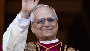 Newly elected Pope Leo XIV (l), the American Robert Prevost, appears on the balcony of St. Peter's Basilica in the Vatican (Credit: Oliver Weiken via Getty Images)
