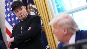 Tesla CEO Elon Musk listens as U.S. President Donald Trump speaks to reporters in the Oval Office of the White House on May 30, 2025 in Washington, DC