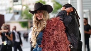 Beyoncé Knowles / Beyonce wears a cowboy hat, a burgundy faux fur fluff coat on one shoulder, a blue denim shirt, during the Louis Vuitton Menswear Spring/Summer 2026 show as part of Paris Fashion Week on June 24, 2025 in Paris, France