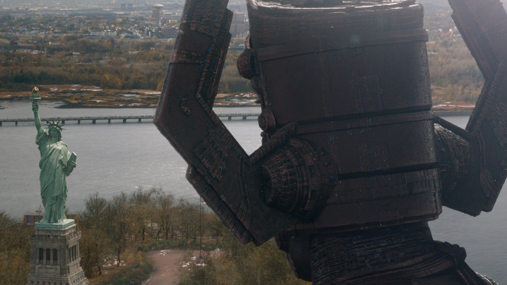 Galactus arrives on Earth, walking up to the Statue of Liberty