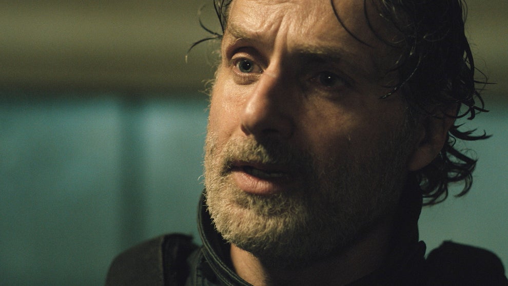 Andrew Lincoln returns as Rick Grimes, looking out of frame with a concerned expression