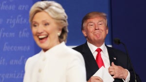 Hillary Clinton walks off stage as Republican presidential nominee Donald Trump smiles after the third U.S. presidential debate in 2016. (Credit: Chip Somodevilla/Getty Images)