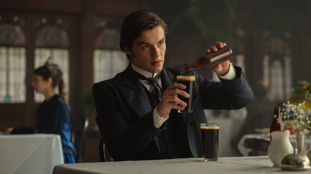 A man pours a beer in "House of Guinness"