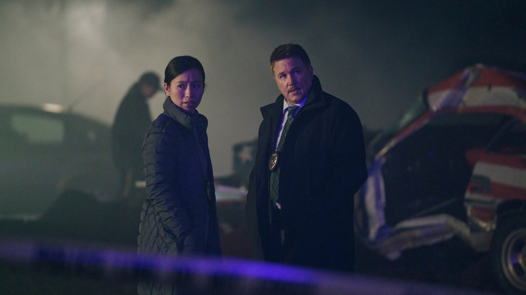 Annie Chang and Lochlyn Munro in "Peacemaker" Season 1