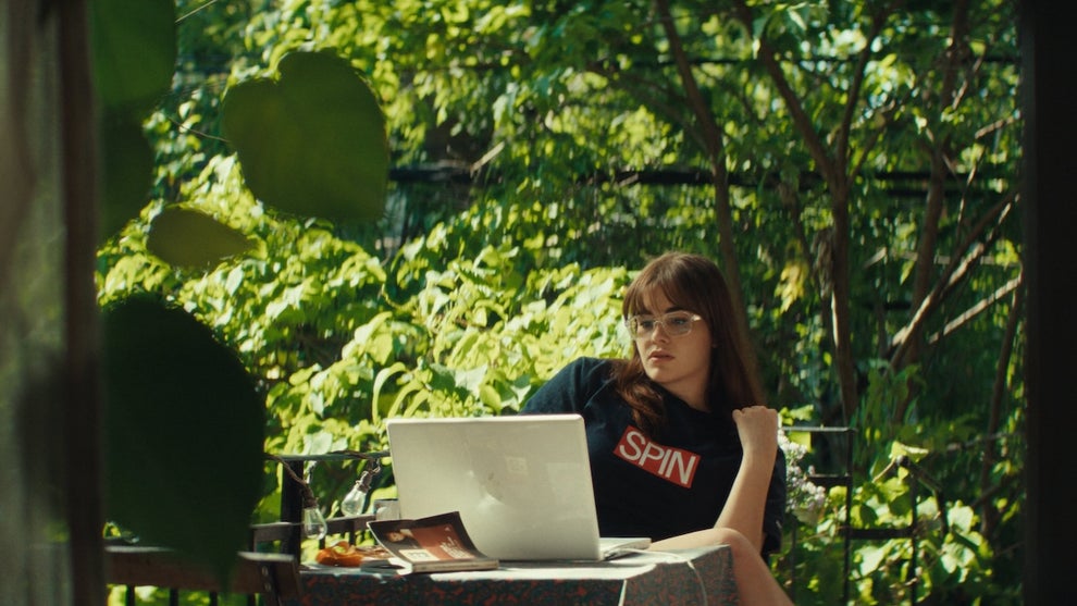 Barbie Ferreira as Grace Pine staring at a computer in a still from writer/director Chandler Levack's Mile End Kicks