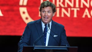 Tucker Carlson speaks during the memorial service for political activist Charlie Kirk at State Farm Stadium on September 21, 2025 in Glendale, Arizona. (Credit: Joe Raedle/Getty Images)