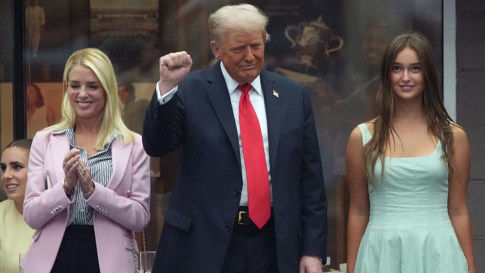 U.S. President Donald Trump pumps his as U.S. Attorney General Pam Bondi (L) and Arabella Kushner (R) look on before the start of the U.S. Open men's singles final at the Billie Jean King National Tennis Center for the U.S. Open finals on September 7, 2025 in New York City