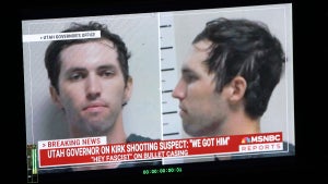 A TV monitor displays a picture of Tyler Robinson, the suspected of killing Charlie Kirk on September 11, in Orem, Utah, on September 12, 2025
