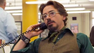 Robert Downey Jr. answers a phone in a bustling bullpen in "Zodiac"