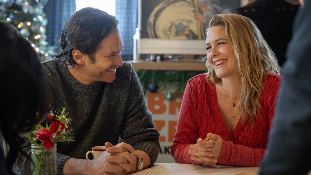 Alicia Silverstone (right) and Oliver Hudson (left) smile at each other in "A Merry Little Ex-Mas"