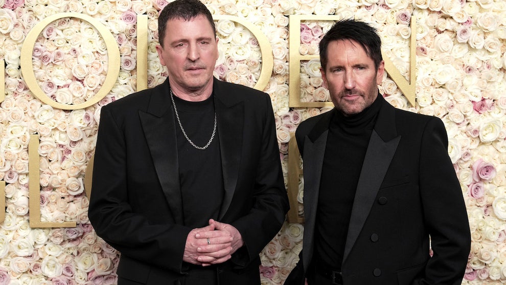 Atticus Ross and Trent Reznor attend the 82nd Annual Golden Globe Awards. (Jeff Kravitz/FilmMagic)