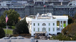 An excavator works to clear rubble after the East Wing of the White House was demolished on October 23, 2025 in Washington, DC