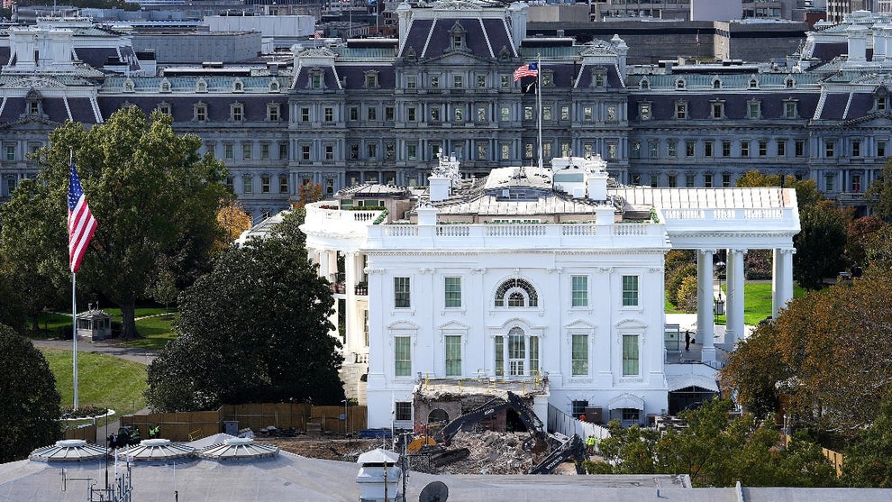 An excavator works to clear rubble after the East Wing of the White House was demolished on October 23, 2025 in Washington, DC