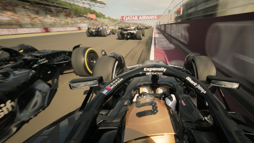 Cars race in "F1: The Movie"