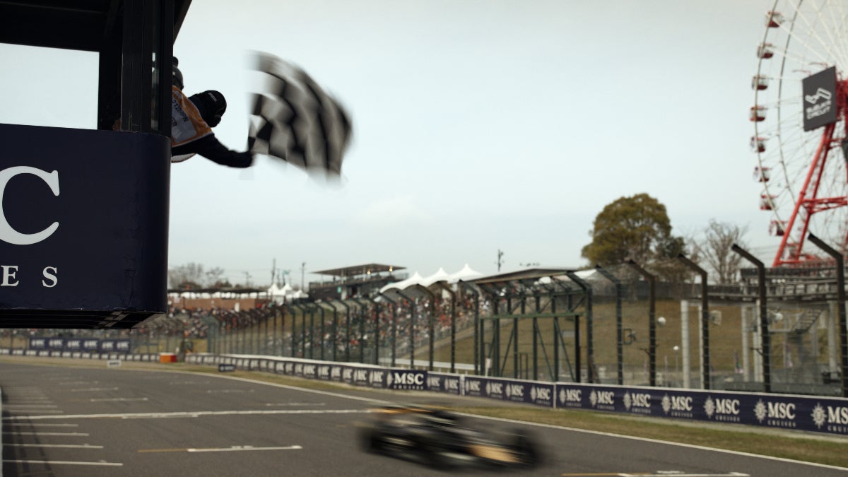 A car races by the finish line in "F1: The Movie"