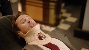 Glen Powell wears a neck brace in SNL sketch