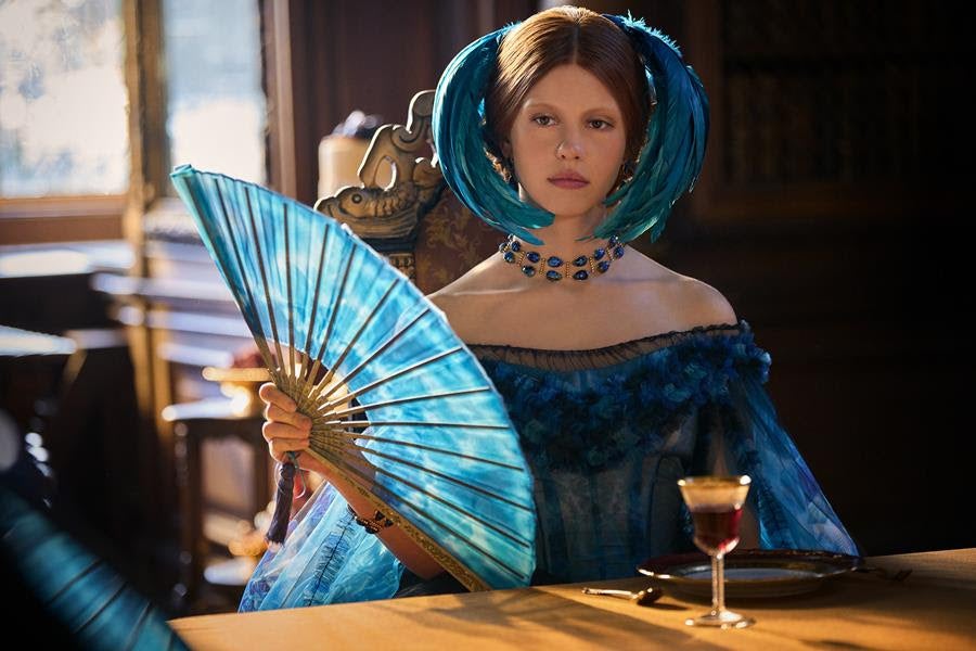Mia Goth as Elizabeth wearing a Tiffany archival scarab necklace in Frankenstein. Source: Netflix