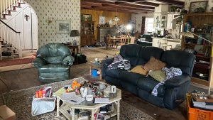 A messy living room from the film "Bugonia"