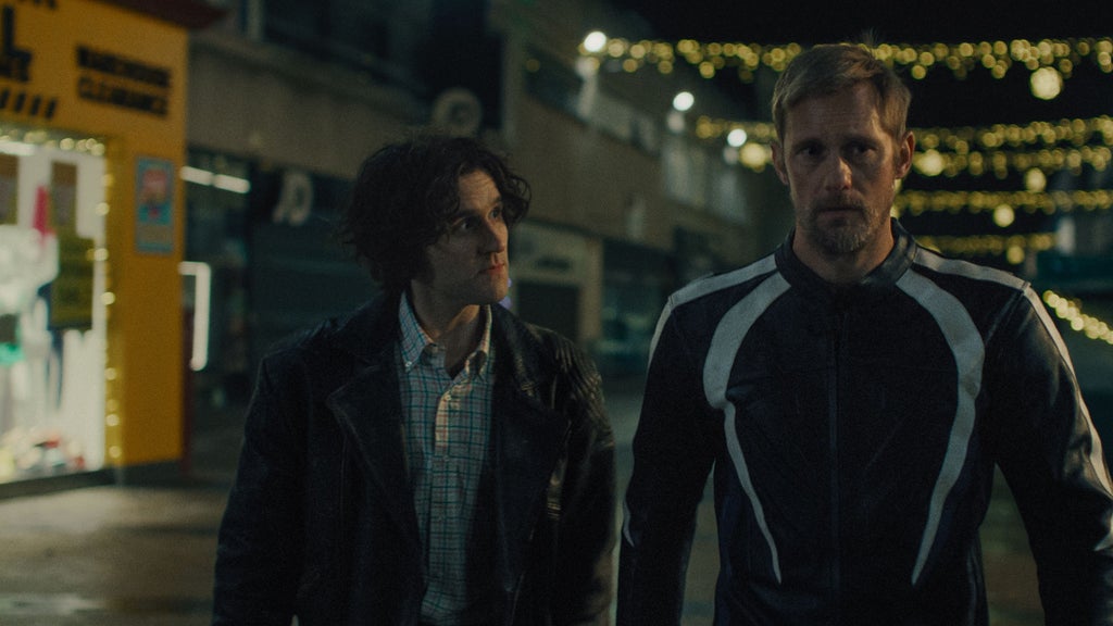 Harry Melling and Alexander Skarsgård in "Pillion"