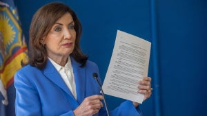 New York State Governor Kathy Hochul signs an executive order allowing pharmacies to distribute the COVID vaccine on Friday, September 5, 2025 in Port Washington, New York. (Credit: Howard Schnapp/Newsday RM via Getty Images)