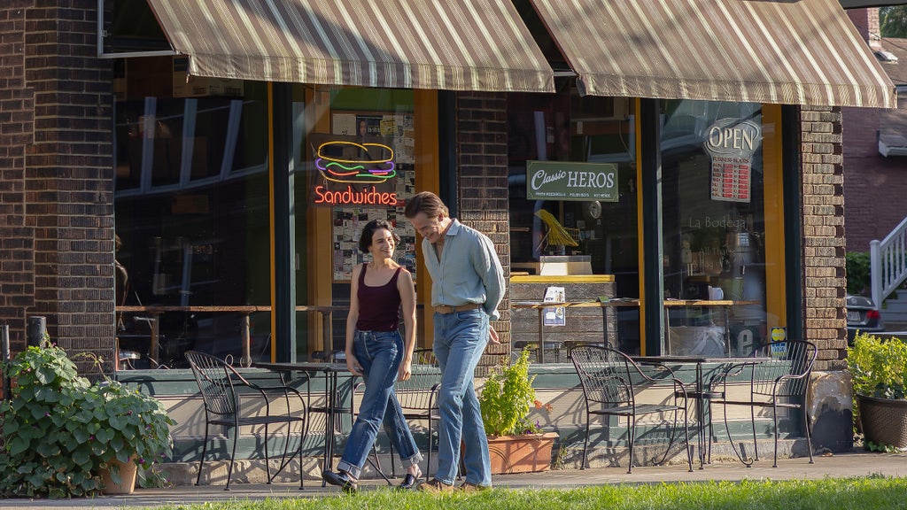 Jenny Slate and Chris Pine walking together outside a sandwich shop in "Carousel"