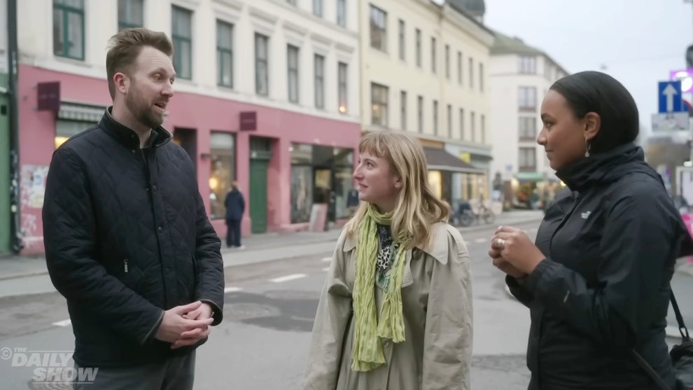 Jordan Klepper interviews two Norwegian citizens for "The Daily Show" (Credit: Comedy Central)