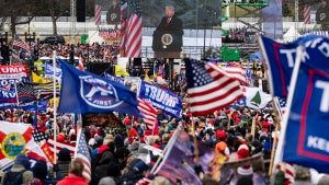 President Donald Trump is seen on a screen as his supporters cheer during a rally on the National Mall on January 6, 2021 in Washington, DC. Trump supporters gathered in the nation's capital today to protest the ratification of President-elect Joe Biden's Electoral College victory over President Trump in the 2020 election. (Credit: Samuel Corum/Getty Images)