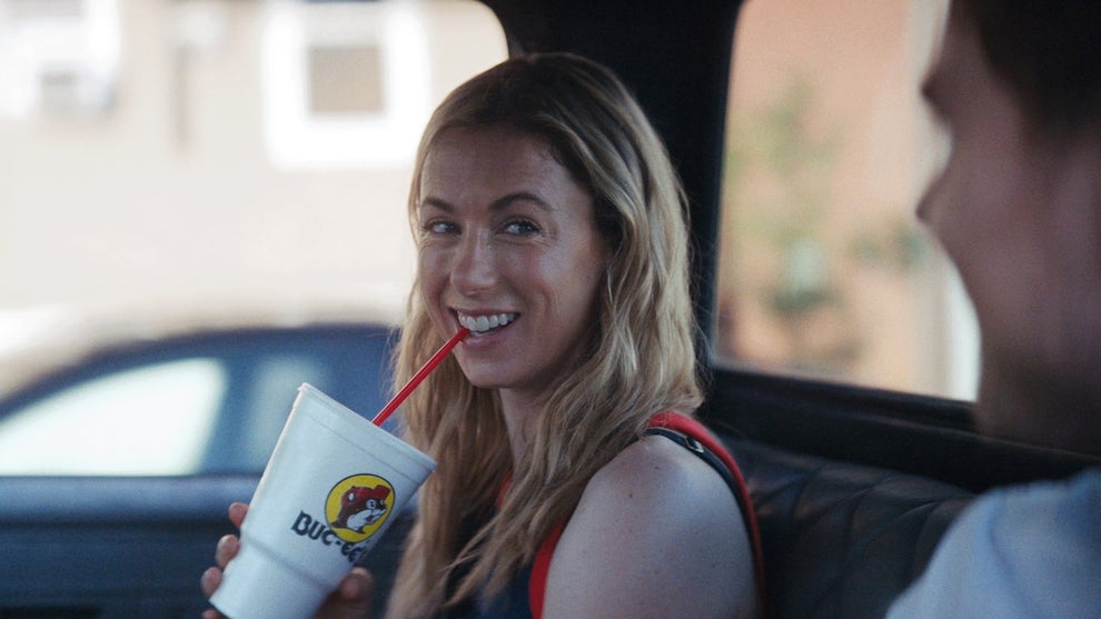 Iliza Shlesinger sits in a car while drinking a big soda of some kind in Chasing Summer by Josephine Decker, an official selection of the 2026 Sundance Film Festival. Courtesy of Sundance Institute | photo by Eric Branco/Summer 2001 LLC