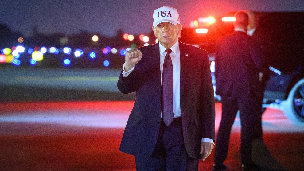 US President Donald Trump gestures as he arrives at Palm Beach International Airport in West Palm Beach, Florida on February 27, 2026