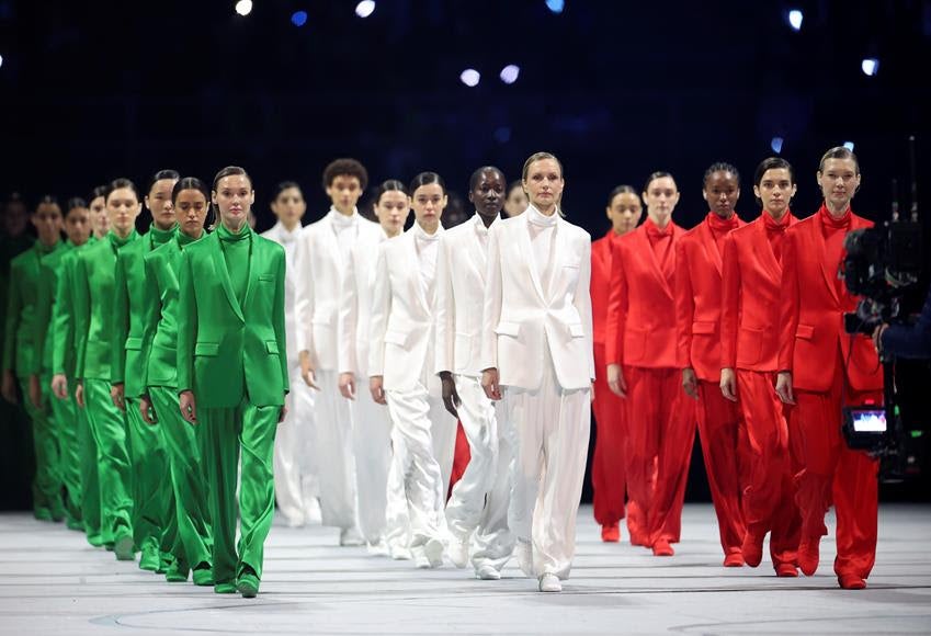 Models walk the runway wearing creations designed by Giorgio Armani during the opening ceremony of the Milano Cortina 2026 Olympic Winter Games at the San Siro Stadium in Milan, Italy, Feb. 6, 2026. Source: Getty