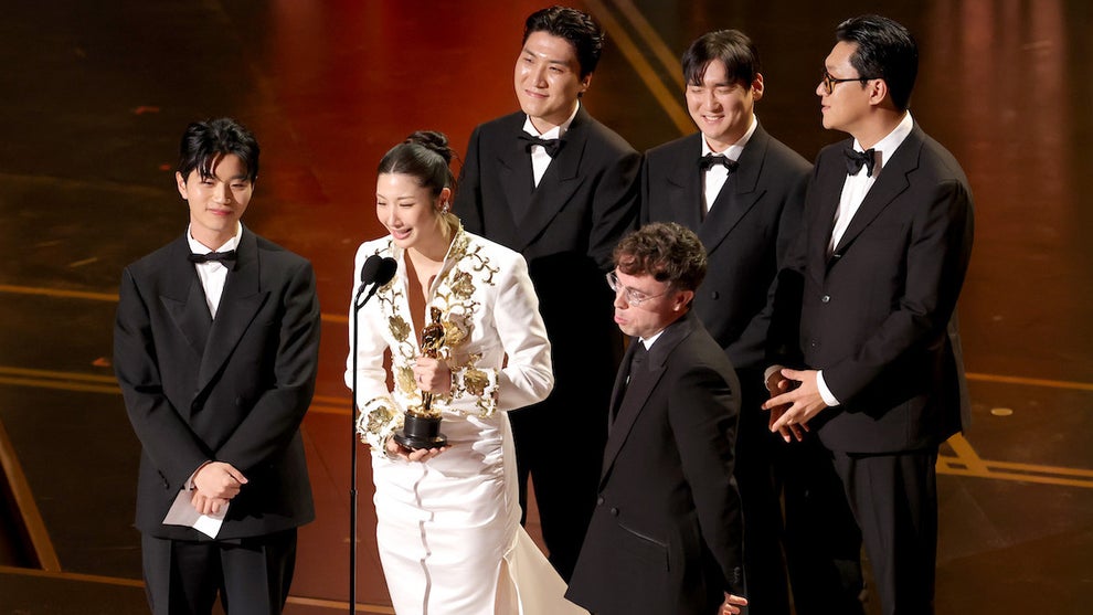 The "KPop Demon Hunters" songwriters behind "Golden" accept their Oscar win. (Kevin Winter/Getty Images)