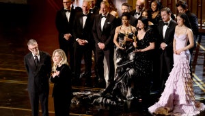 Paul Thomas Anderson, Sarah Murphy, Anthony Carlino, Will Weiske, Andy Jurgensen, Teyana Taylor, Michael Bauman, Cassandra Kulukundis, Regina Hall, Shayna McHale aka Junglepussy, Leonardo DiCaprio, Chase Infiniti and Benicio del Toro accept the Best Picture win for "One Battle After Another" at the 98th Academy Awards. (Kevin Winter/Getty Images)