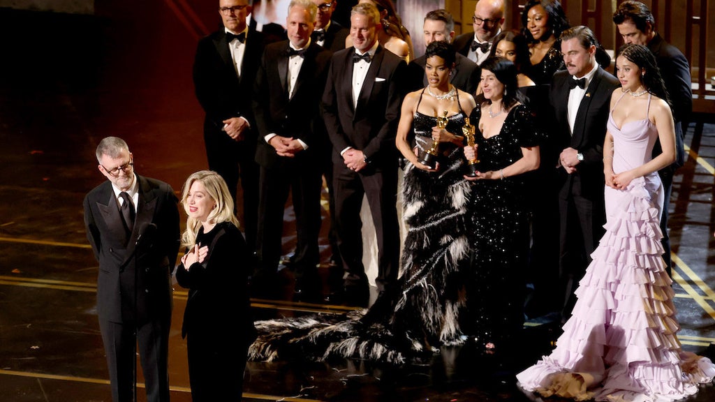 Paul Thomas Anderson, Sarah Murphy, Anthony Carlino, Will Weiske, Andy Jurgensen, Teyana Taylor, Michael Bauman, Cassandra Kulukundis, Regina Hall, Shayna McHale aka Junglepussy, Leonardo DiCaprio, Chase Infiniti and Benicio del Toro accept the Best Picture win for "One Battle After Another" at the 98th Academy Awards. (Kevin Winter/Getty Images)