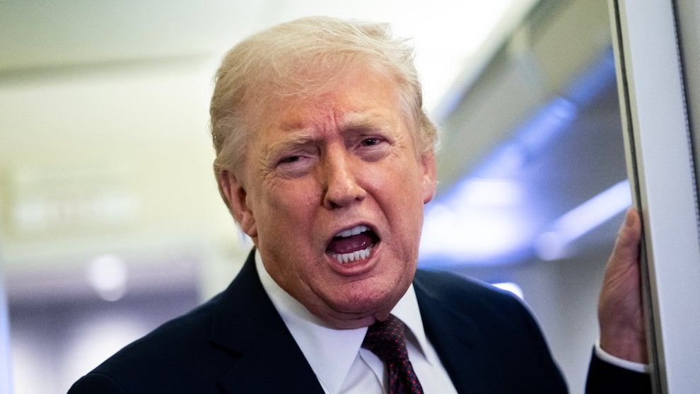 U.S. President Donald Trump speaks to members of the media onboard Air Force One on March 15, 2026 while en route to Joint Base Andrews, Maryland from West Palm Beach Florida
