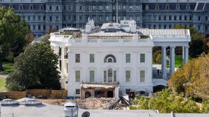 An excavator works to clear rubble after the East Wing of the White House was demolished on October 23, 2025 in Washington, DC