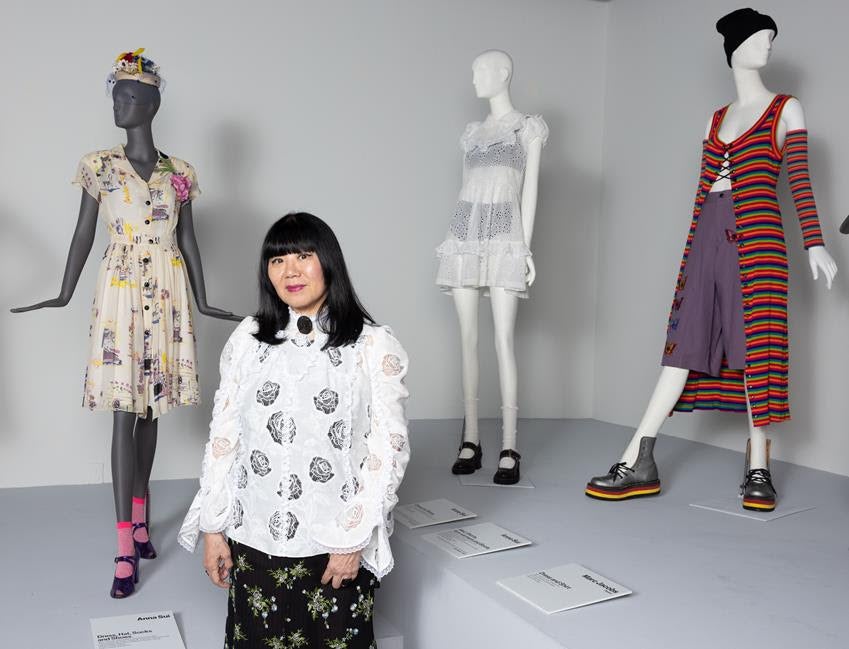 Anna Sui in front of pieces from her 1991 grunge collection at the ASU FIDM Museum in L.A. Source: ASU FIDM