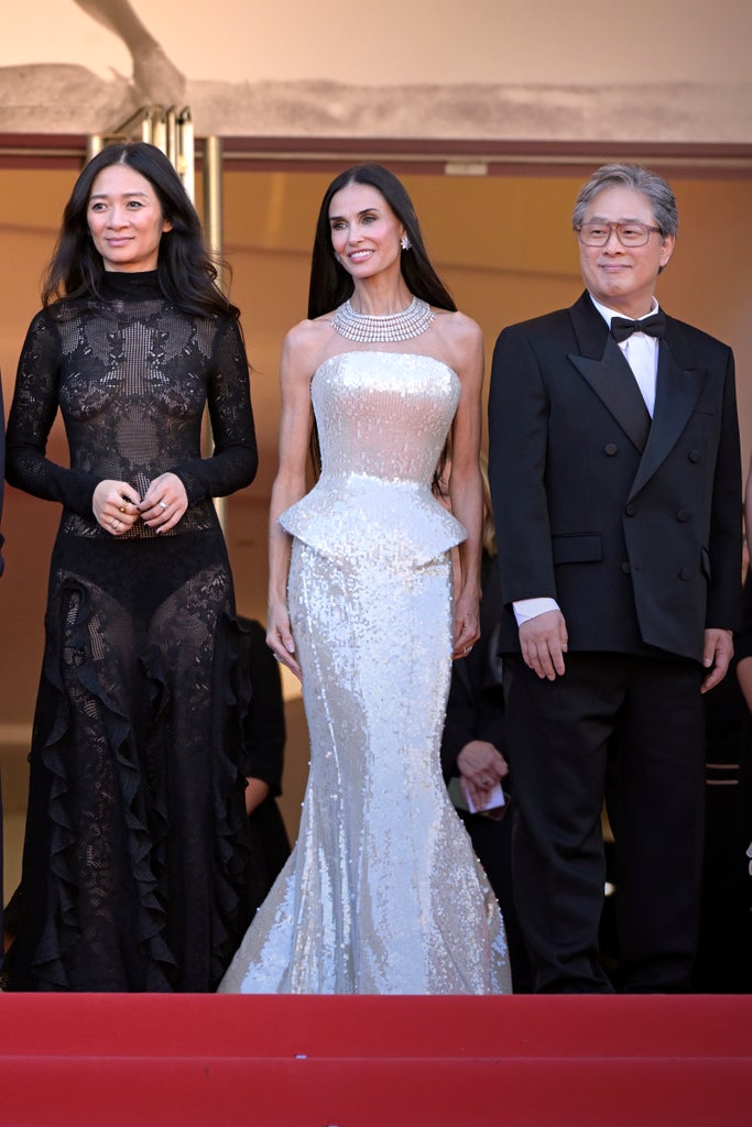 Chloé Zhao, American actress Demi Moore, and South Korean director Park Chan-wook at Cannes Film Festival 2026. Opening Ceremony and Red Carpet for La Vénus Electrique (The Electric Venus)