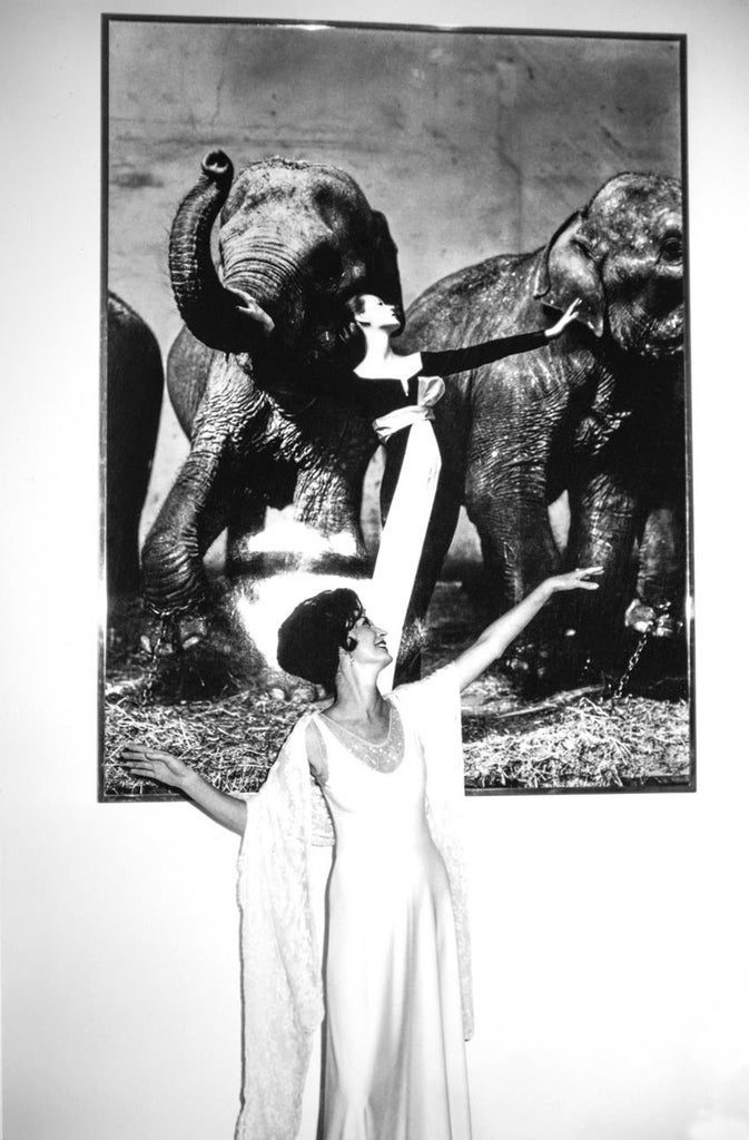 American model Dovima poses in front of her portrait by photographer Richard Avedon at the Metropolitan Museum of Art in 1978. Source: Getty Images