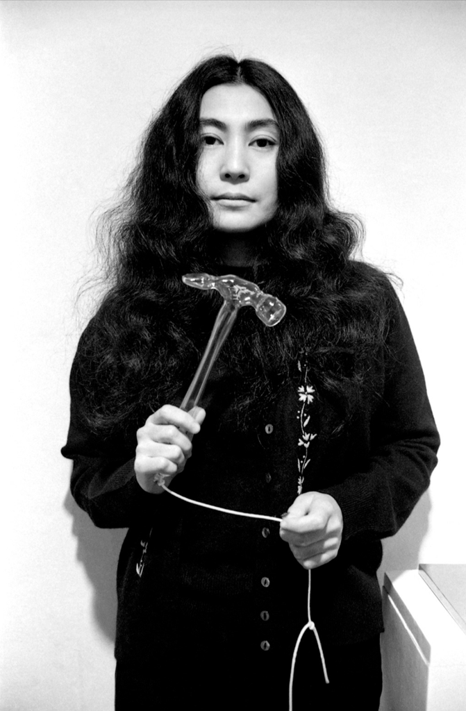 Yoko Ono Holding Glass Hammer (1967), in Yoko Ono at Lisson: Half-A-Wind Show, Lisson Gallery, London, (1967). Source: Yoko Ono/Clay Perry/The Broad.