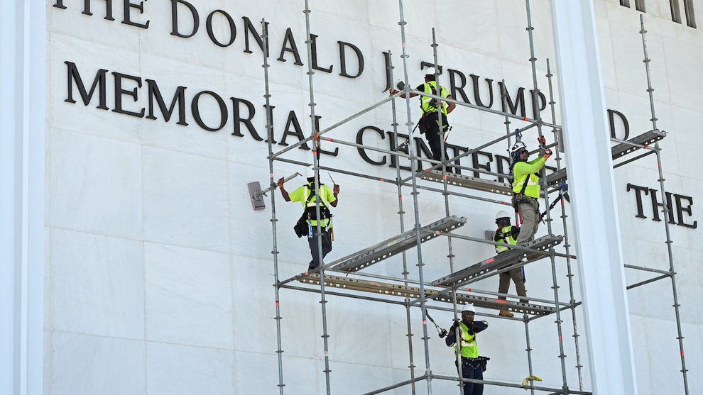 Workers stand on scaffolding near the signage for the Donald J. Trump and John F. Kennedy Memorial Center for the Performing Arts in Washington, DC, on June 12, 2026. (Alex Wroblewski/AFP via Getty Images)