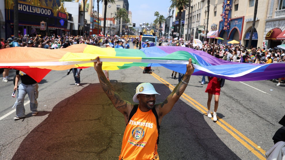 Parade participants carry a large Pride flag during the 55th Annual LA Pride Parade on June 8, 2025 in Hollywood, California. (Blake Fagan/AFP via Getty Images)
