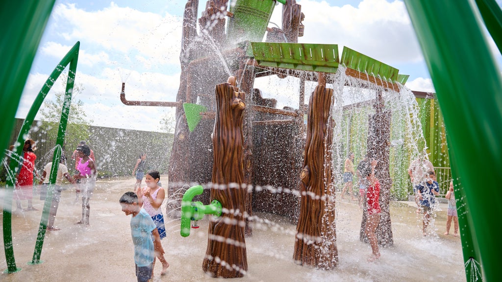 Kids play in a Shrek-themed splash pad at Universal Kids Resort