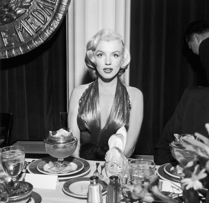 Monroe wearing a modified Travilla dress from Gentlemen Prefer Blondes to the 1953 Photoplay Gold Medal Awards dinner. Monroe won two of the magazine's awards. Source: Getty