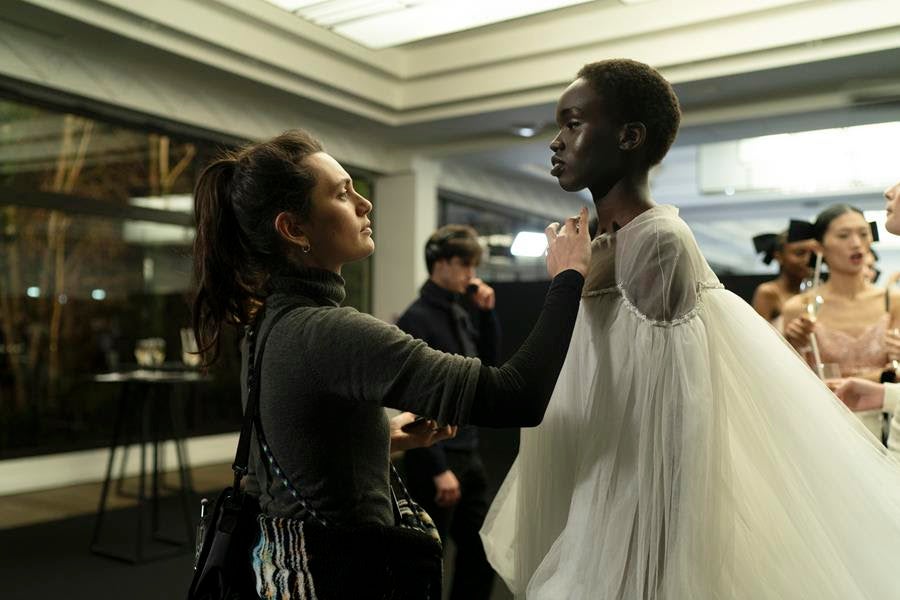 Makeup artist Angèle (Ella Rumpf) and model Ada (Anyier Anei) backstage at a runway show in the film Couture. Source: Vertical