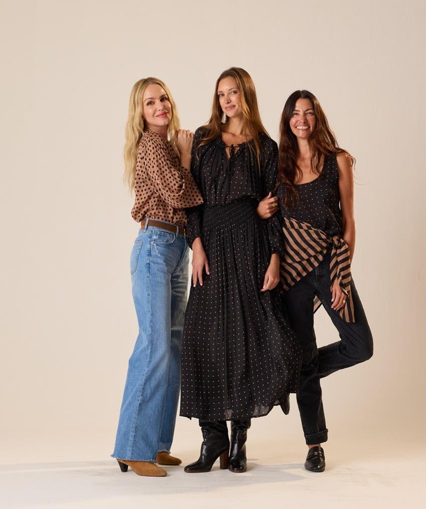 Monét Mazur, left, and designer Natalie Martin, right, pose with a model. All are wearing the Natalie Martin x Monét Mazur collection. Source: Natalie Martin