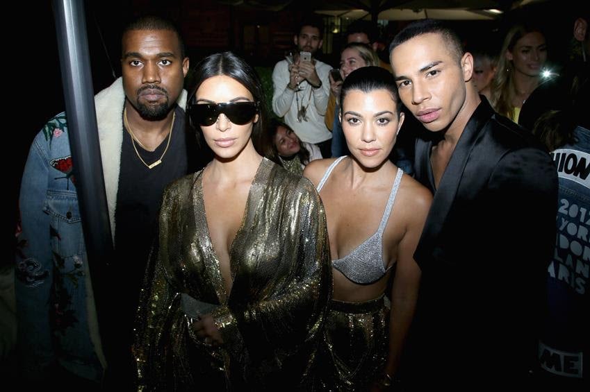 Kanye West, Kim Kardashian, Kourtney Kardashian and Olivier Rousteing attend the Balmain aftershow party at Paris Fashion Week on Sept. 29, 2016. Source: Getty
