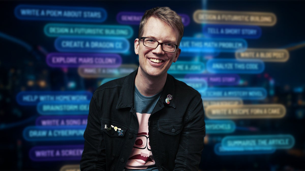 Hank Green against a wall of AI prompts (Photo Credit: YouTube, Christopher Smith)