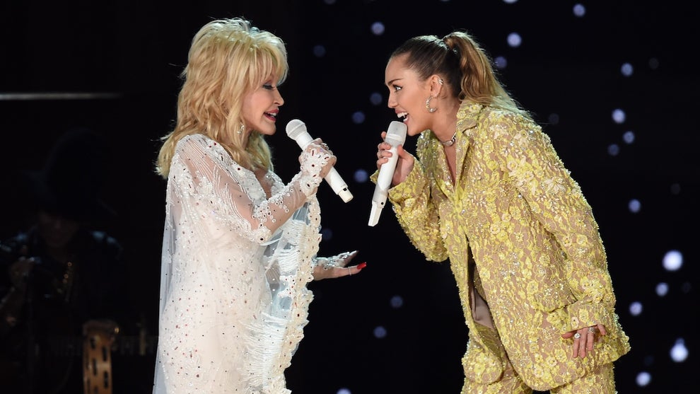 Miley Cyrus and Dolly Parton during the 61st Annual GRAMMY Awards at Staples Center on February 10, 2019 in Los Angeles, California. (Credit: Kevin Winter/Getty Images for The Recording Academy)