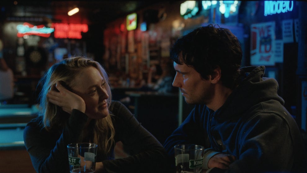 Dakota Johnson and Cory Michael Smith in "The Sun Never Sets" (Credit: Independent Film Company)