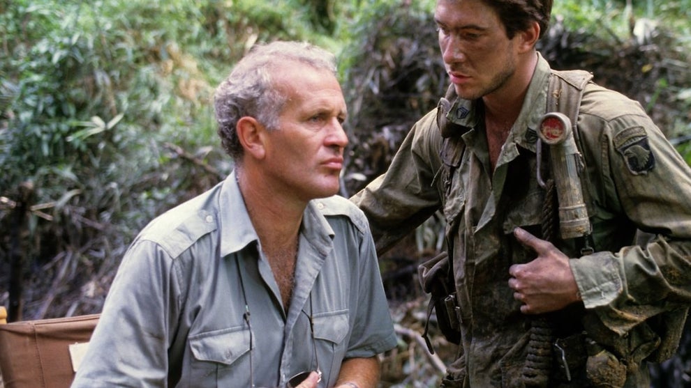 British film director John Irvin (left) with American actor Dylan McDermott on the set of Irvin's Vietnam war film 'Hamburger Hill', in production close to Manila in the Philippines, 4th November 1986. (Photo by Alex Bowie/Getty Images)